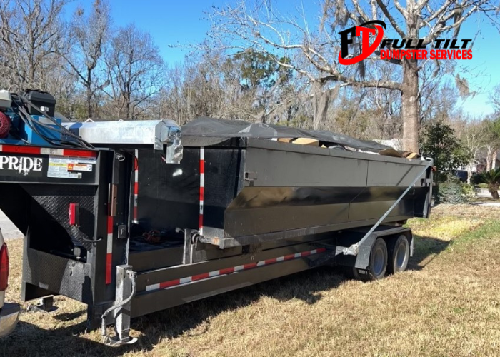 about full tilt dumpster services - dumpster rental in the yard of someone's property in macclenny, FL